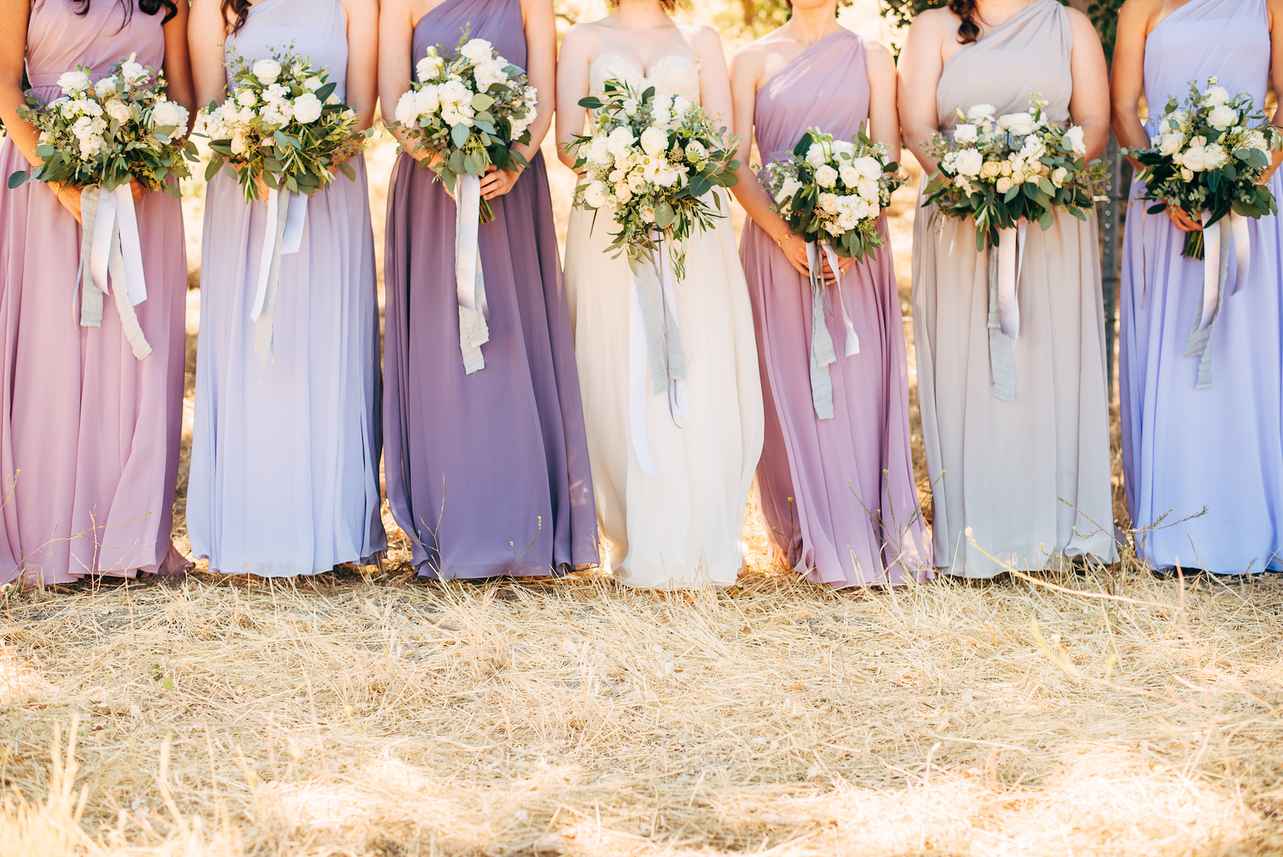 White wedding flowers with lavender bridesmaid dresses