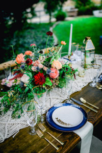 The Flying Caballos Ranch Edna Valley wedding venue with bright centerpiece by Flowers by Denise